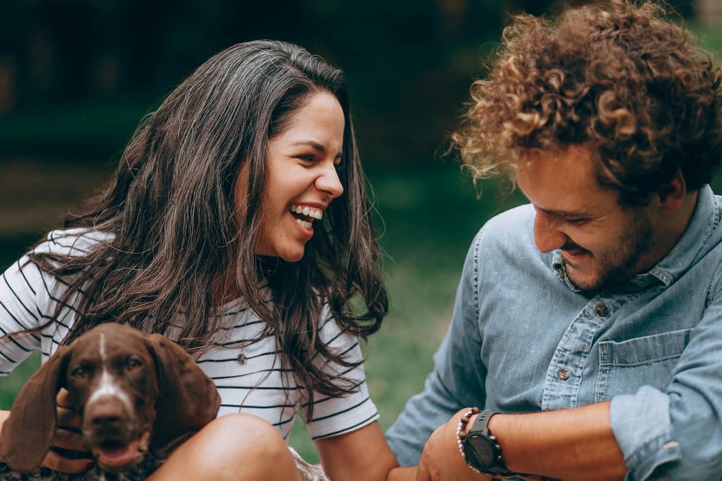 happy couple with dog